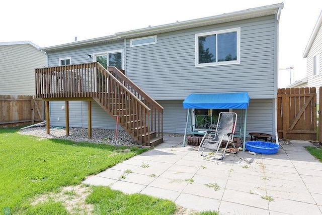 2441 60th Ave S, Fargo, ND 58104 - back of property with a patio area, stairway, and a wooden deck
