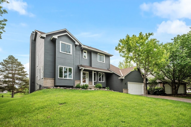 8798 Fountain Ln N, Maple Grove, MN 55311 - traditional-style house featuring an attached garage, a front yard, asphalt driveway, and a chimney