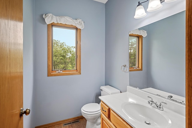 8798 Fountain Ln N, Maple Grove, MN 55311 - bathroom with toilet and vanity