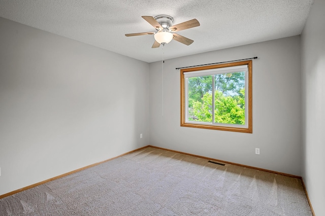 8798 Fountain Ln N, Maple Grove, MN 55311 - empty room featuring light colored carpet, ceiling fan, and a textured ceiling