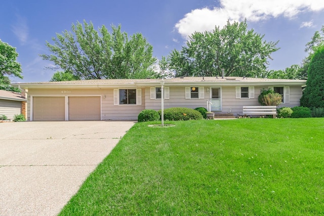 4901 99th St, Bloomington, MN 55437 - ranch-style house with an attached garage, concrete driveway, and a front yard