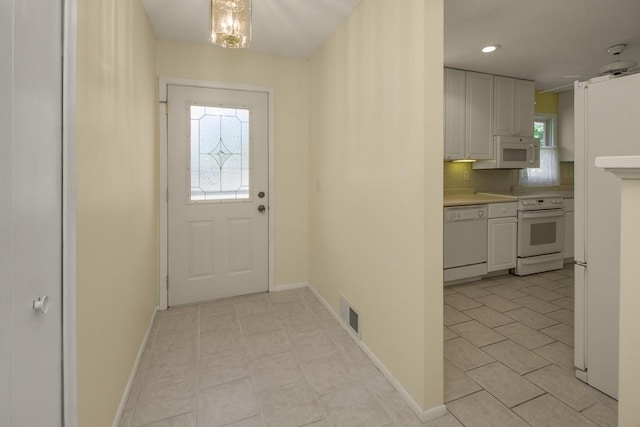 4901 99th St, Bloomington, MN 55437 - doorway featuring light tile patterned floors and recessed lighting