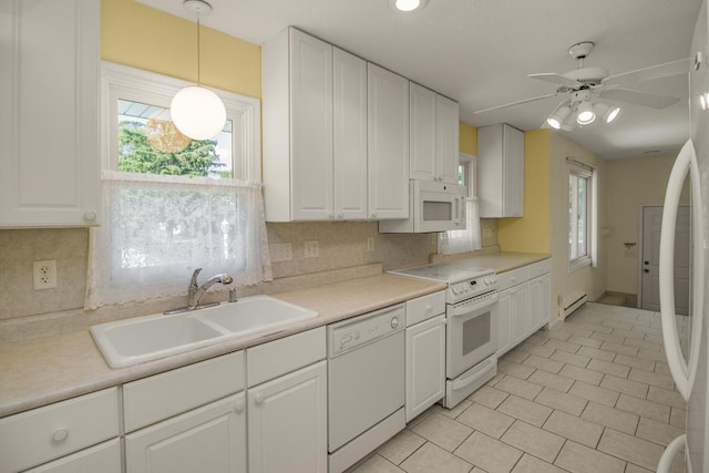 4901 99th St, Bloomington, MN 55437 - kitchen with white appliances, decorative backsplash, white cabinets, a baseboard heating unit, and a ceiling fan