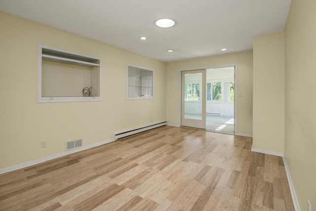 4901 99th St, Bloomington, MN 55437 - unfurnished room with a baseboard heating unit, wood finished floors, and recessed lighting