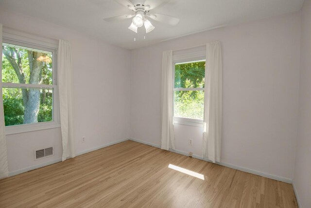 4901 99th St, Bloomington, MN 55437 - spare room featuring light wood-style floors and a ceiling fan