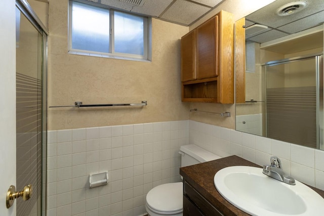 4901 99th St, Bloomington, MN 55437 - full bath with tile walls, a stall shower, and vanity