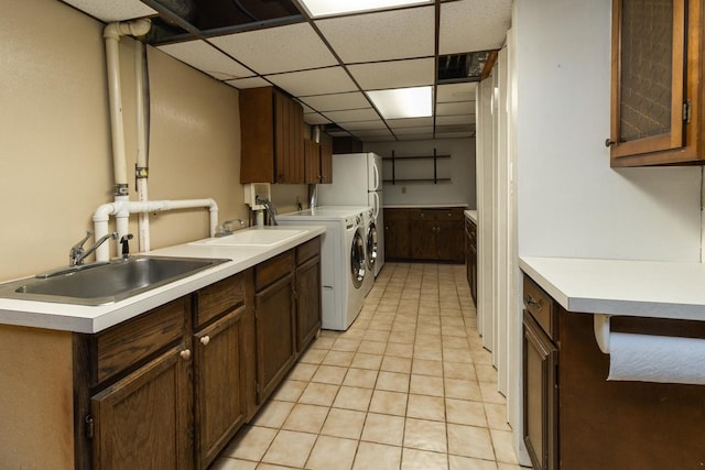 4901 99th St, Bloomington, MN 55437 - laundry room featuring cabinet space, washing machine and clothes dryer, and light tile patterned flooring