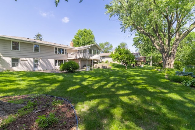 4901 99th St, Bloomington, MN 55437 - view of green lawn featuring a wooden deck