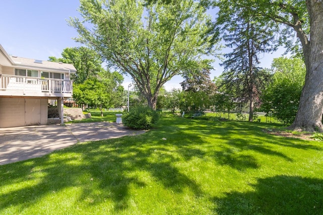 4901 99th St, Bloomington, MN 55437 - view of green lawn with a wooden deck