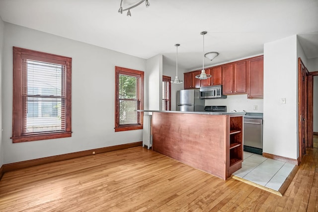 1812 Clinton Ave Unit 203, Minneapolis, MN 55404 - kitchen with stainless steel appliances, light wood finished floors, hanging light fixtures, and open shelves