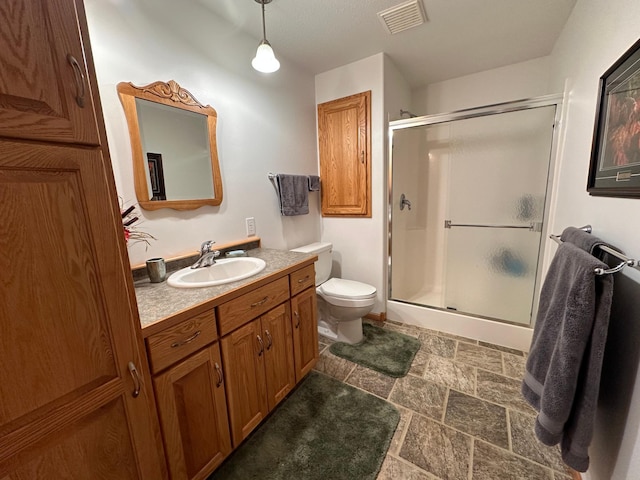 16521 Silver Ln NW, Evansville, MN 56326 - bathroom featuring a shower with door, vanity, and stone finish floors