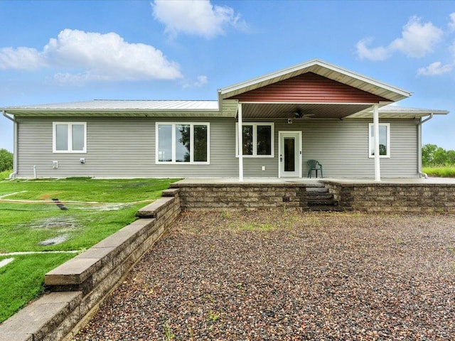 39561 Outing Ct, Fawn Lake Twp, MN 56438 - back of property with a ceiling fan, a metal roof, and a lawn