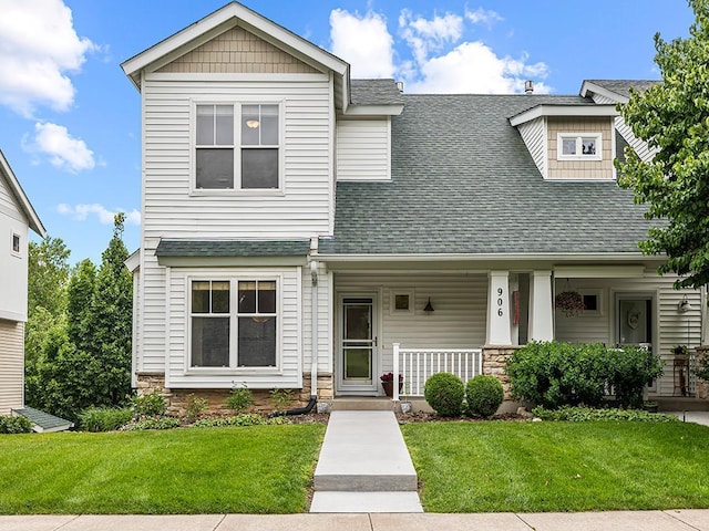 906 New Century Blvd S, Maplewood, MN 55119 - view of front of house with roof with shingles, stone siding, covered porch, and a front lawn