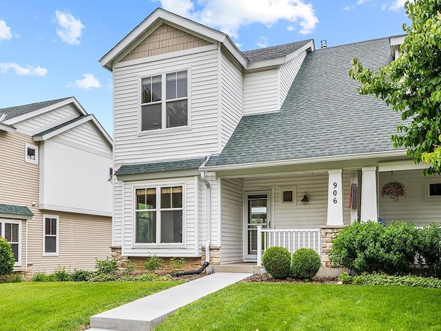 906 New Century Blvd S, Maplewood, MN 55119 - view of front of home with a shingled roof, a front lawn, a porch, and stone siding