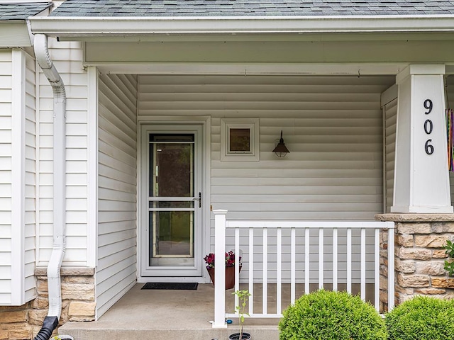 906 New Century Blvd S, Maplewood, MN 55119 - entrance to property featuring roof with shingles and a porch