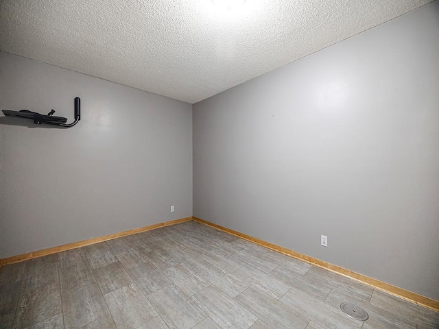 906 New Century Blvd S, Maplewood, MN 55119 - empty room with a textured ceiling and wood finished floors