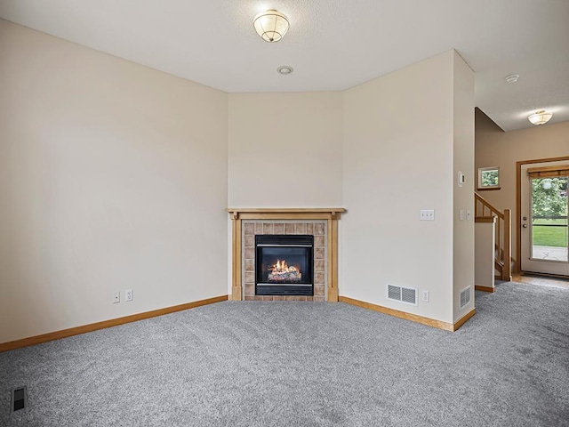 906 New Century Blvd S, Maplewood, MN 55119 - unfurnished living room with carpet, a fireplace, and stairs