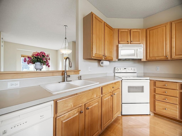 906 New Century Blvd S, Maplewood, MN 55119 - kitchen featuring white appliances, light wood-style floors, light countertops, and a textured ceiling