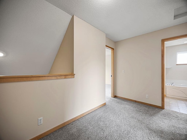 906 New Century Blvd S, Maplewood, MN 55119 - spare room featuring a textured ceiling and carpet floors