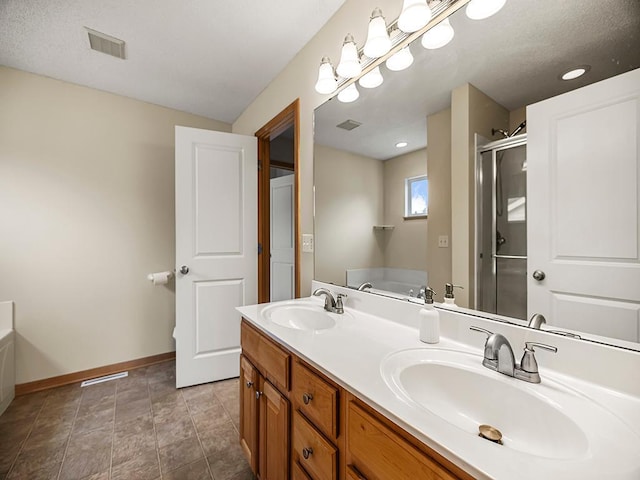 906 New Century Blvd S, Maplewood, MN 55119 - full bathroom featuring a garden tub, double vanity, and a stall shower