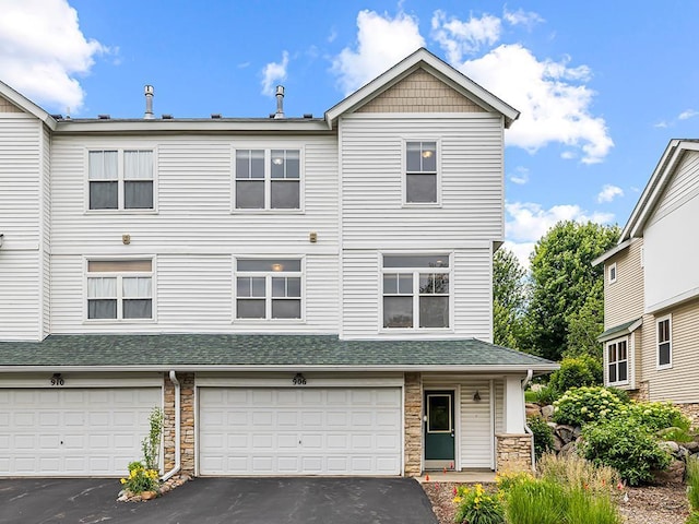 906 New Century Blvd S, Maplewood, MN 55119 - multi unit property featuring stone siding, asphalt driveway, a garage, and a shingled roof