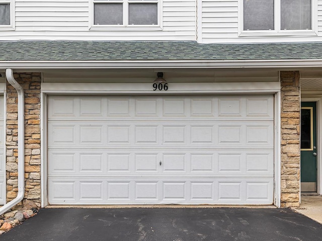 906 New Century Blvd S, Maplewood, MN 55119 - garage with asphalt driveway