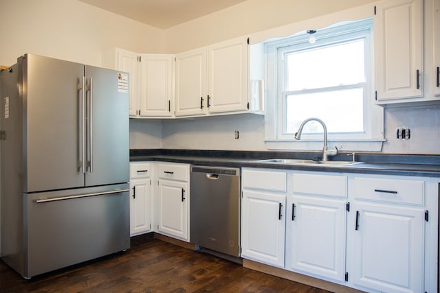 305 2nd Ave SE, Plainview, MN 55964 - kitchen featuring stainless steel appliances, dark countertops, white cabinets, and dark wood-style floors