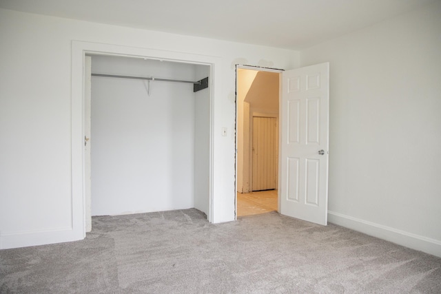 305 2nd Ave SE, Plainview, MN 55964 - unfurnished bedroom featuring carpet and a closet