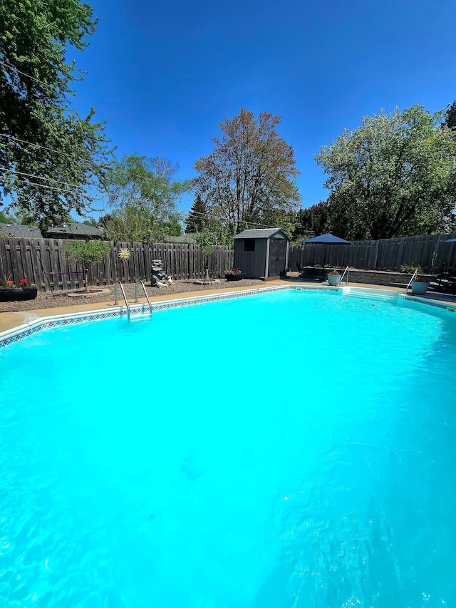8047 Ingleside Ave S, Cottage Grove, MN 55016 - view of pool featuring a storage unit and a fenced backyard