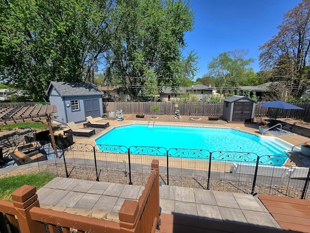8047 Ingleside Ave S, Cottage Grove, MN 55016 - view of swimming pool featuring a storage unit, a fenced backyard, and a patio area