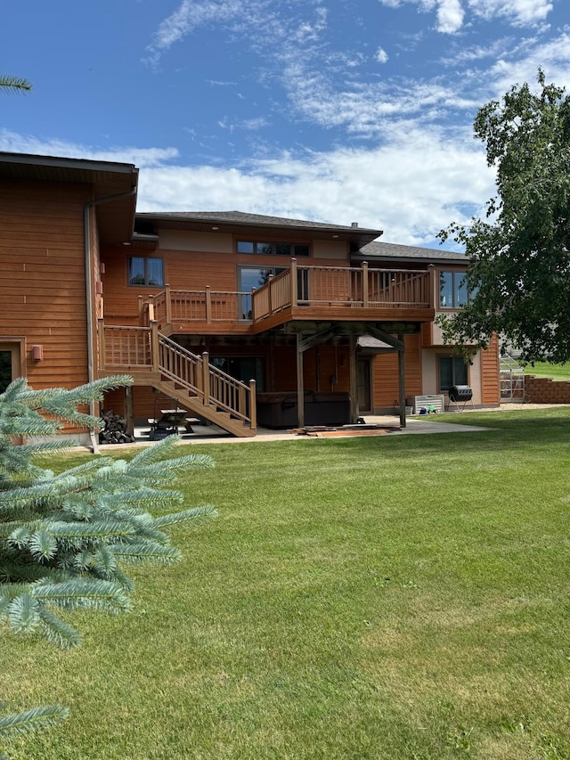 1905 Abby Rd, Cumberland, WI 54829 - back of house featuring stairway, a deck, and a yard