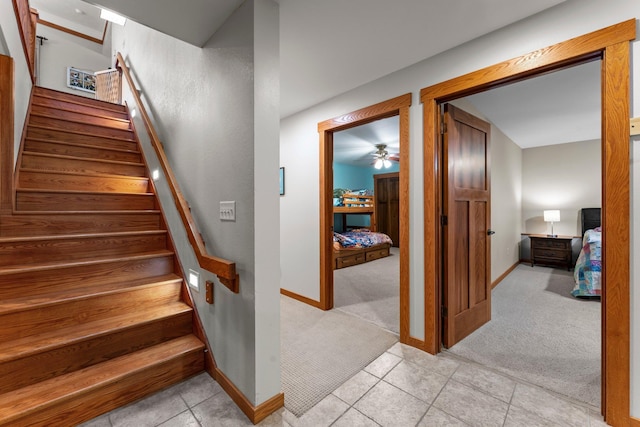 1905 Abby Rd, Cumberland, WI 54829 - stairway featuring carpet, tile patterned floors, and ceiling fan