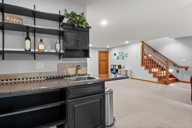 1905 Abby Rd, Cumberland, WI 54829 - kitchen featuring dark countertops, open shelves, recessed lighting, tasteful backsplash, and carpet floors
