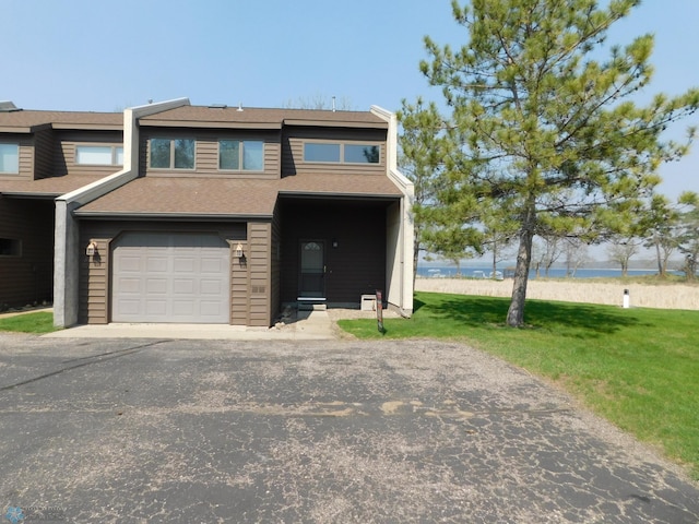 42710 County Highway 56 Unit 101, Toad Lake Twp, MN 56544 - view of property featuring a front lawn, a water view, asphalt driveway, an attached garage, and roof with shingles