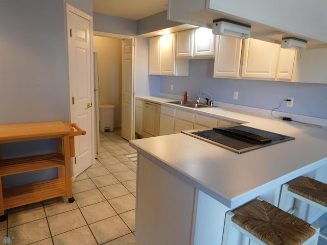 42710 County Highway 56 Unit 101, Toad Lake Twp, MN 56544 - kitchen with dishwashing machine, a peninsula, light countertops, cooktop, and white cabinets