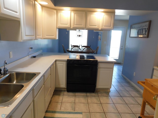 42710 County Highway 56 Unit 101, Toad Lake Twp, MN 56544 - kitchen featuring black / electric stove, white cabinets, and light tile patterned floors