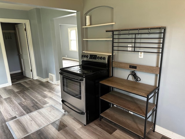 551 Center St, Tracy, MN 56175 - kitchen with electric range, wood finished floors, and open shelves
