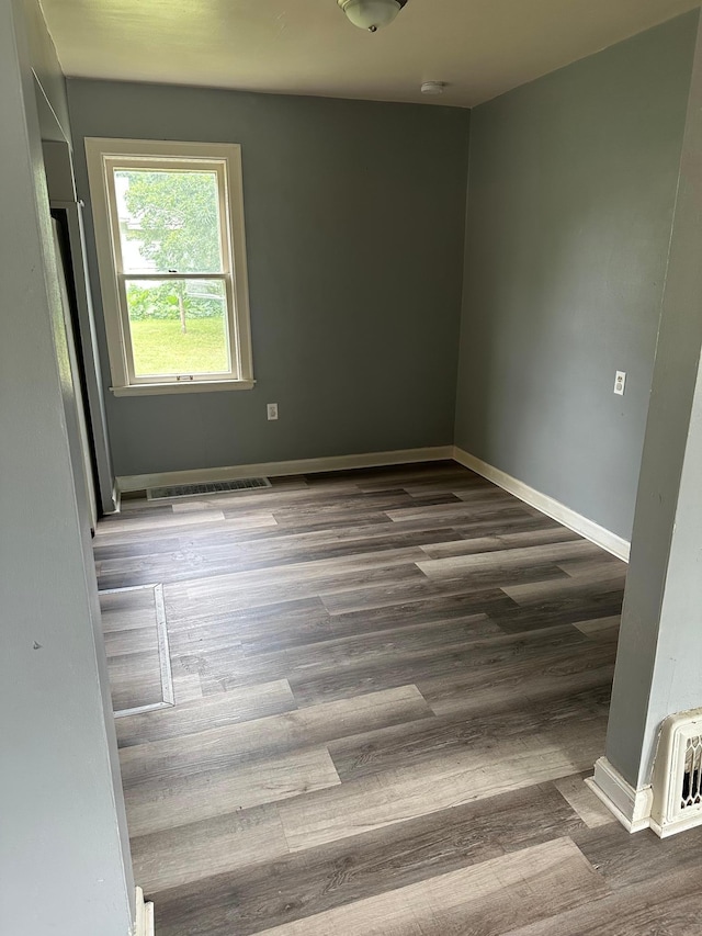 551 Center St, Tracy, MN 56175 - spare room with wood finished floors and a smoke detector