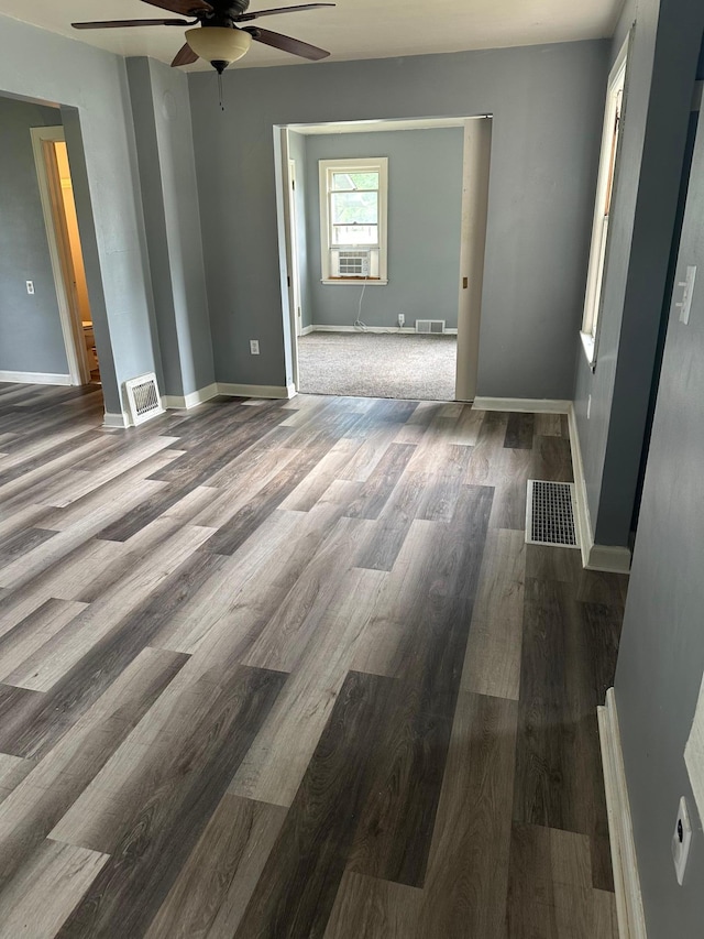 551 Center St, Tracy, MN 56175 - unfurnished room featuring a ceiling fan and wood finished floors