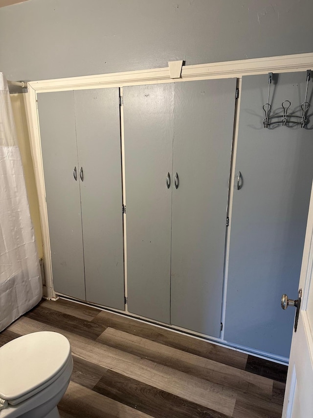 551 Center St, Tracy, MN 56175 - full bathroom featuring wood finished floors and curtained shower