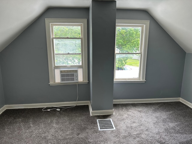 551 Center St, Tracy, MN 56175 - bonus room with vaulted ceiling, plenty of natural light, carpet, and cooling unit