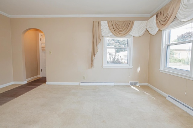 462 Saint Charles St, Winona, MN 55987 - spare room featuring baseboard heating, carpet flooring, arched walkways, crown molding, and a baseboard radiator