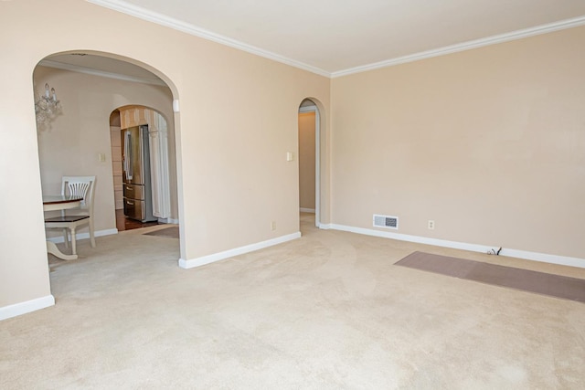 462 Saint Charles St, Winona, MN 55987 - carpeted empty room featuring arched walkways and crown molding