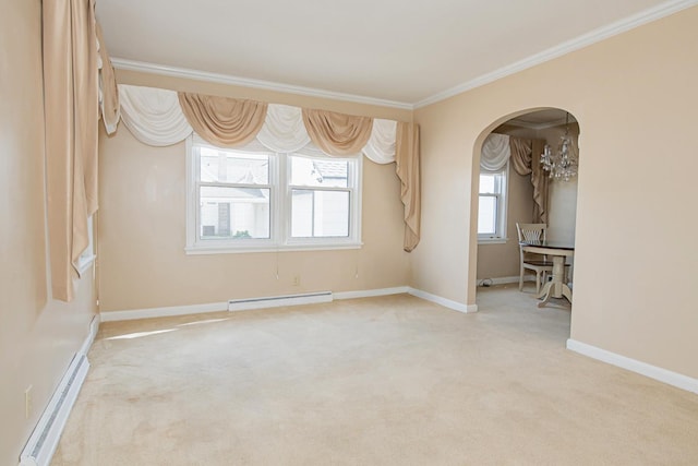 462 Saint Charles St, Winona, MN 55987 - carpeted spare room featuring a baseboard heating unit, a baseboard radiator, crown molding, and arched walkways
