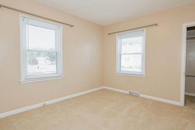 462 Saint Charles St, Winona, MN 55987 - unfurnished bedroom with carpet flooring, a spacious closet, and a closet