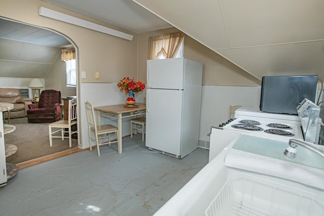 462 Saint Charles St, Winona, MN 55987 - kitchen with white appliances, lofted ceiling, and wainscoting
