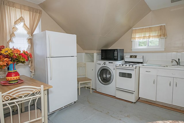 462 Saint Charles St, Winona, MN 55987 - kitchen featuring white appliances, vaulted ceiling, washer / dryer, white cabinets, and light countertops
