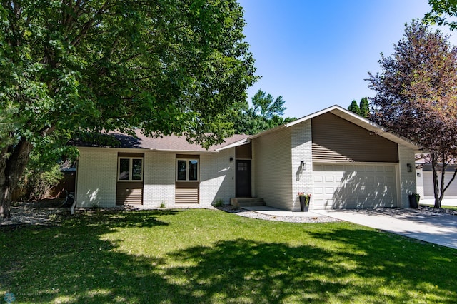 25 Birch Ln S, Fargo, ND 58103 - view of front of house featuring brick siding, an attached garage, a front yard, driveway, and entry steps
