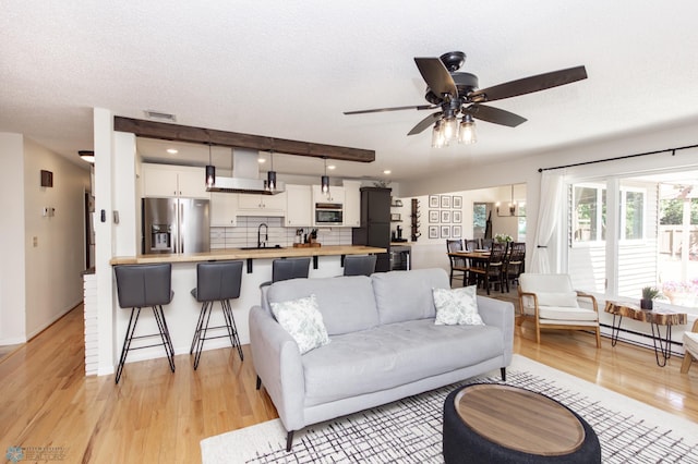 25 Birch Ln S, Fargo, ND 58103 - living area featuring light wood-style flooring and ceiling fan