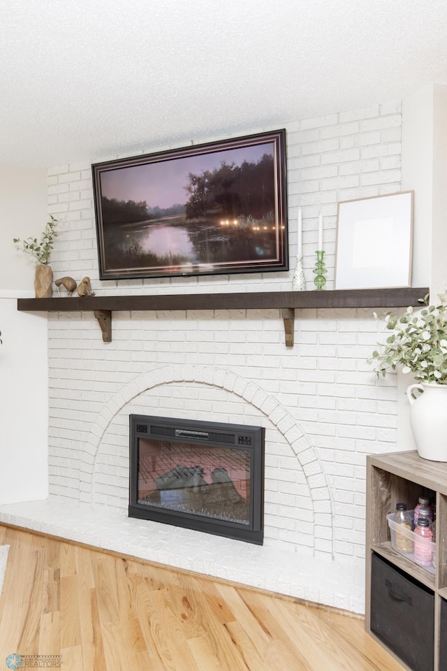 25 Birch Ln S, Fargo, ND 58103 - detailed view of a brick fireplace and wood finished floors